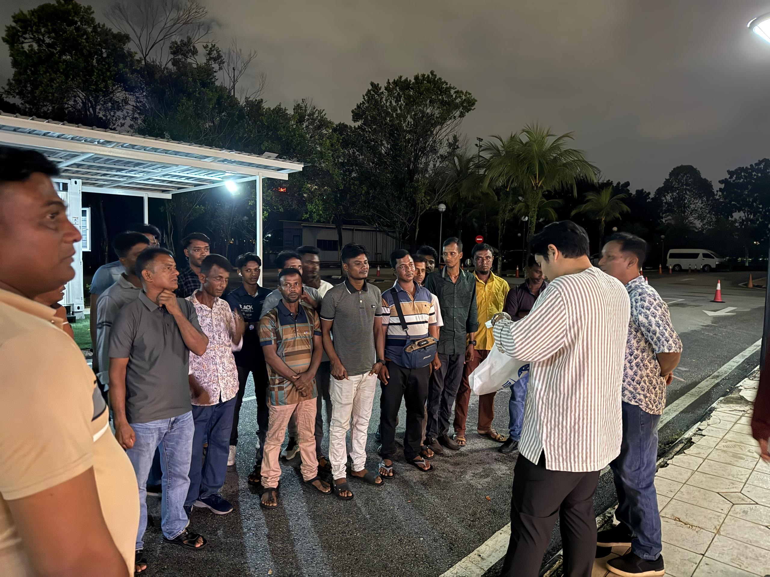Jeeb speaking with members of his operating team on site at night